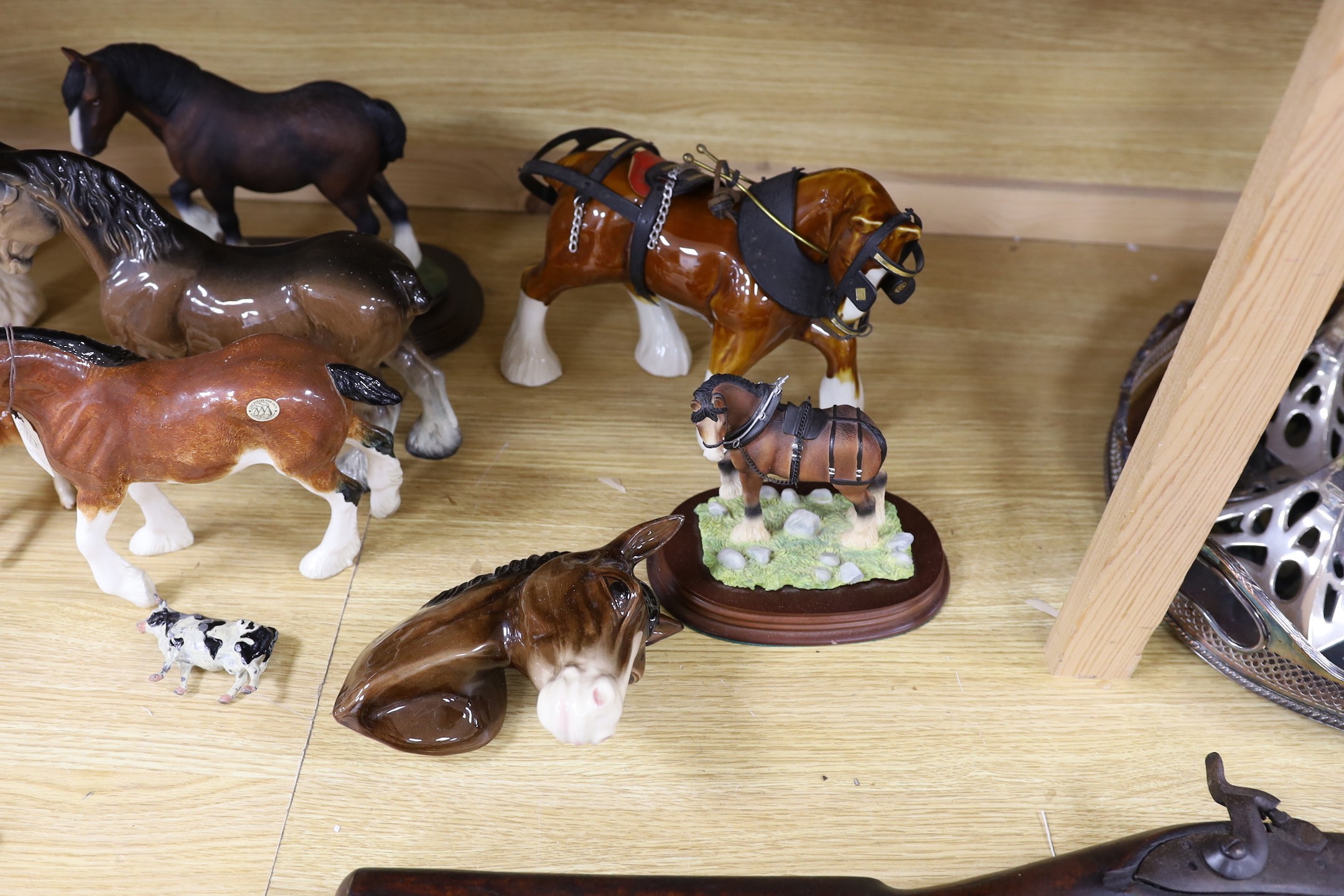 A collection of mixed Beswick, horses, to include cart horses a wall pocket, white glazed horse and a Border Fine Arts Clysdale Stallion